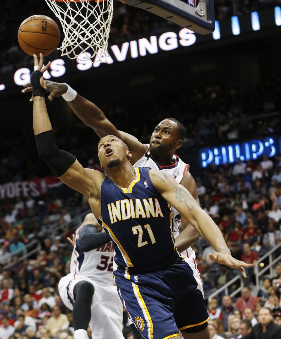 CORRECTS TO THURSDAY NOT WEDNESDAY - Indiana Pacers forward David West (21) goes up to shoot against Atlanta Hawks forward Elton Brand in the first half of Game 3 of an NBA basketball first-round playoff series on Thursday, April 24, 2014 in Atlanta. (AP Photo/John Bazemore)