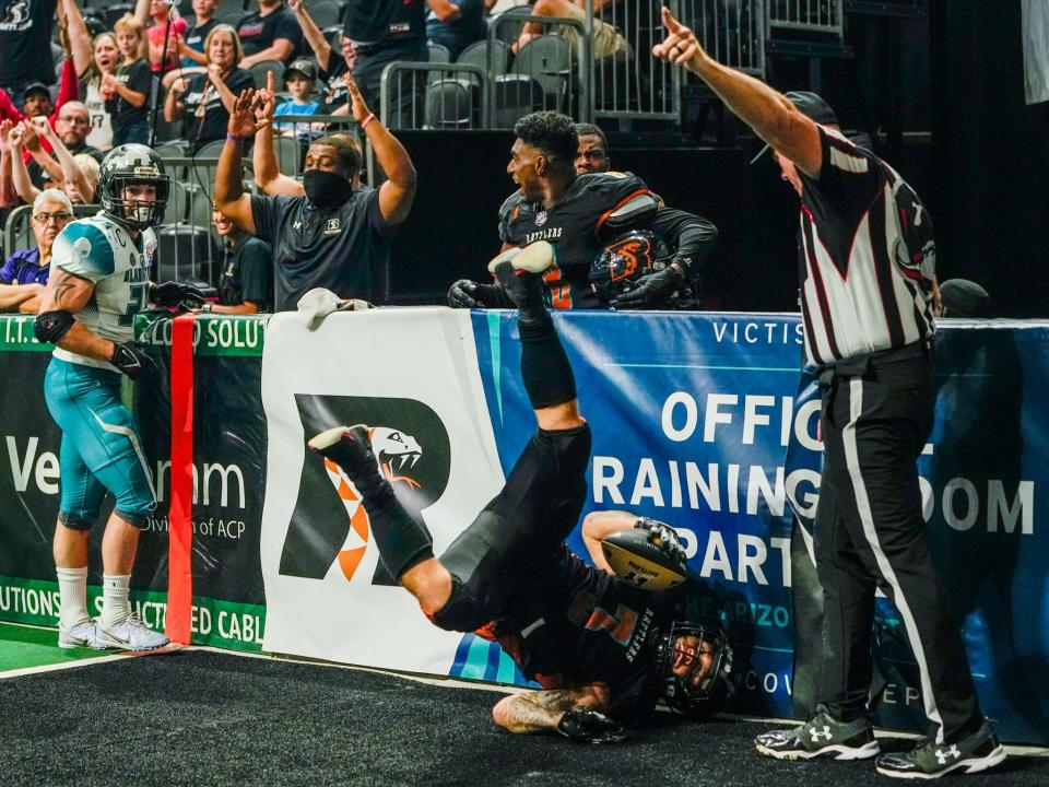 July 24, 2022; Phoenix, Ariz., U.S.; Arizona Rattlers running back Shannon Brooks (3) scores a touchdown during the first half of the Indoor Football League playoffs against the Duke City Gladiators at the Footprint Center in Phoenix on July 24, 2022. Mandatory Credit: Samantha Chow/The Republic