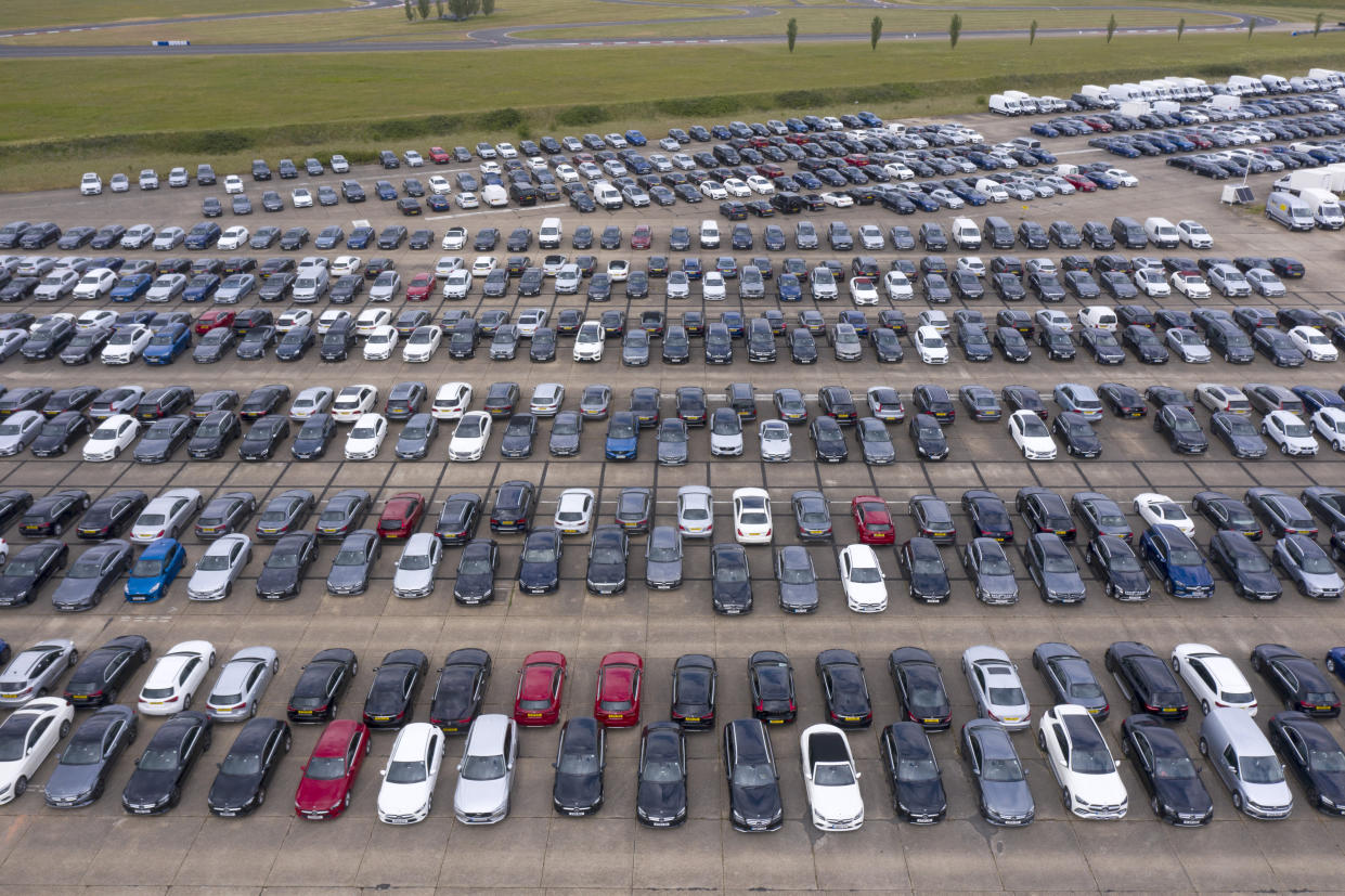 THURLEIGH, BEDFORDSHIRE - JUNE 09: Thousands of unwanted new and used cars line up on June 09, 2020, at Thurleigh Airfield in Bedfordshire. Britain's economy slumped by 20.4% in April in the biggest monthly decline since records began as the coronavirus lockdown paralyzed the country. (Permission from Aerodrome for flight). (Photo by Chris Gorman/Getty Images)