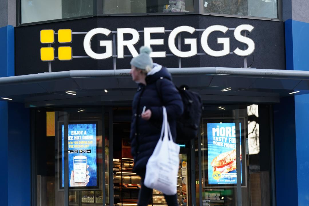 A customer leaves the Greggs store in Piccadilly Circus, central London, as the high street bakery chain has said it does not plan to hike prices over the year ahead, but is unlikely to be able to offer price cuts as rising wages keep costs under pressure. The chain is set to open between 140 and 160 new shops on a net basis in 2024 as it looks to give customers more convenient access to its stores. Picture date: Wednesday January 10, 2024.