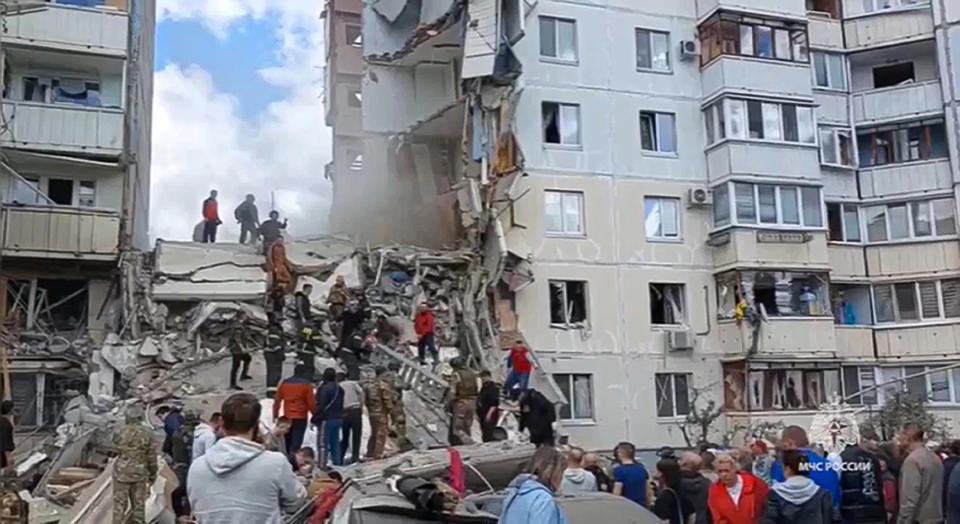 In this photo taken from video released by the Russian Emergency Ministry Press Service on Sunday, May 12, 2024, Russian emergency services work at the scene of a partially collapsed block of flats authorities said was hit during an attack by Ukrainian shelling, in Belgorod, Russia. (Russian Emergency Ministry Press Service via AP)