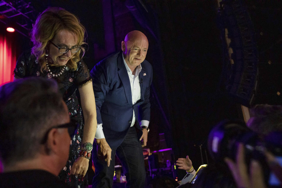 Sen. Mark Kelly, D-Ariz., with his wife former Rep. Gabrielle Giffords greets supporters at an election night event in Tucson, Ariz., Tuesday, Nov. 8, 2022.(AP Photo/Alberto Mariani)