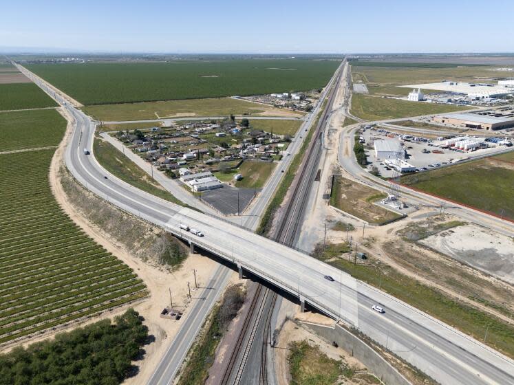 SHAFTER, CA- MARCH 20: Plans for the Wonderful Industrial Park, right, include expansion to the west, left; an inland port bringing in goods by rail from the Port of Los Angeles and sending out agriculture as well as a truck bypass road to keep traffic and emissions away from disadvantaged communities. The rail terminal would remove the equivalent of 240 diesel trucks from the roads. Photographed at Wonderful Industrial Park in Shafter, CA on Wednesday, March 20, 2024. (Myung J. Chun / Los Angeles Times)