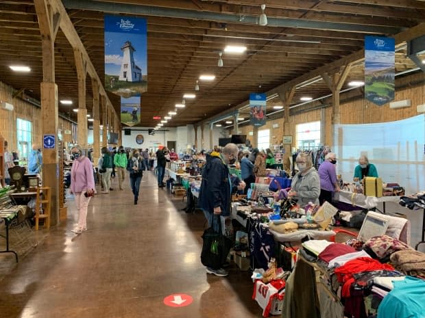 Masked-up shoppers browse items at the flea market at the Charlottetown seaport. The flea market runs Sundays from 9 a.m. to 2 p.m.