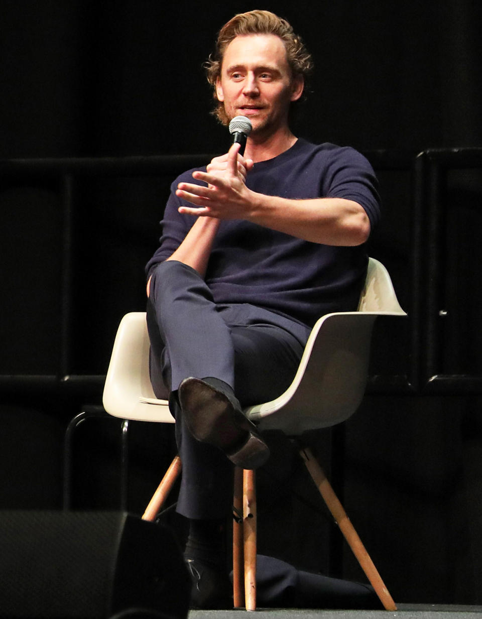 <p><em>Loki</em> star Tom Hiddleston speaks at the MCM London Comic Con event at Excel in London on Oct. 23.</p>