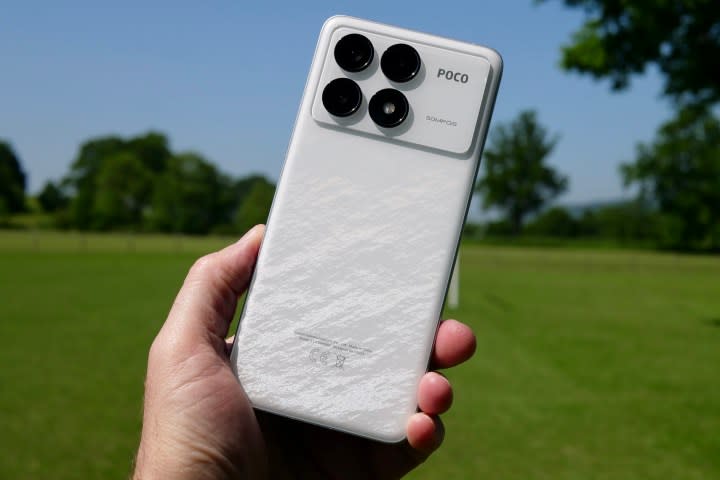 A person holding the Poco F6 Pro.