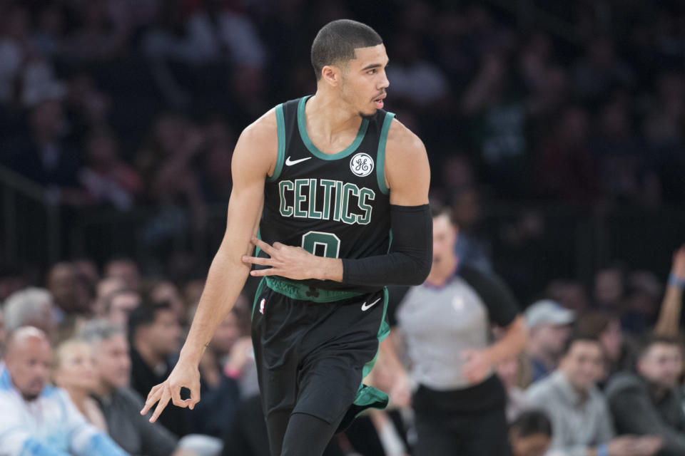 Boston Celtics forward Jayson Tatum gestures after scoring a three-point goal during the first half of an NBA basketball game against the New York Knicks, Saturday, Oct. 20, 2018, at Madison Square Garden in New York. (AP Photo/Mary Altaffer)