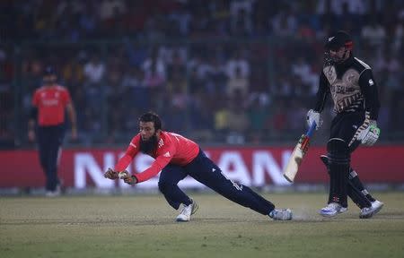 Cricket - England v New Zealand - World Twenty20 cricket tournament semi-final - New Delhi, India - 30/03/2016. England's Moeen Ali fieds the ball. REUTERS/Adnan Abidi