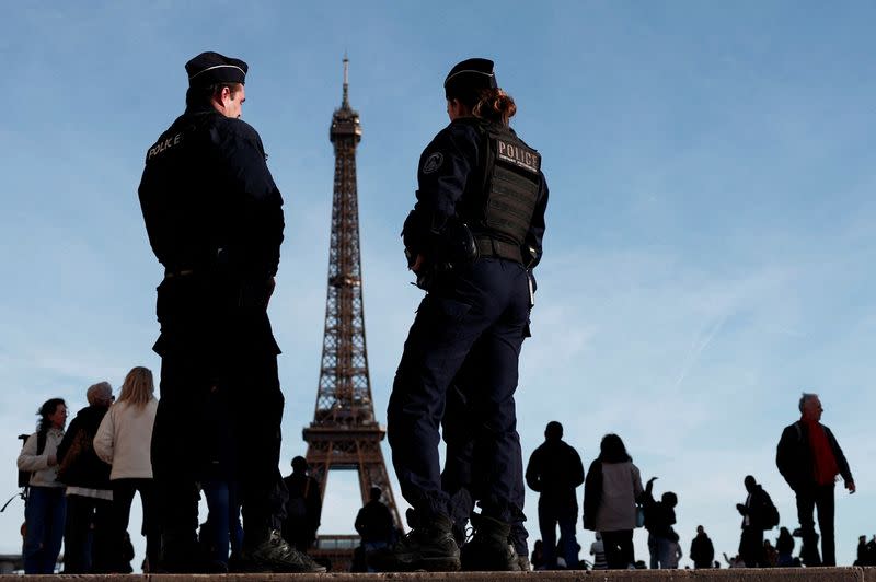 FILE PHOTO: French police patrol near the Eiffel Tower in Paris