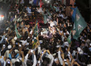A vehicle carrying former Pakistani Prime Minister Nawaz Sharif is surrounded by his supporters following his release from prison in Rawalpindi, Pakistan, Wednesday, Sept. 19, 2018. The Islamabad High Court set him and his daughter and son-in-law free on bail pending their appeal hearings. The court made the decision on the corruption case handed down to the Sharifs by an anti-graft tribunal earlier this year. (AP Photo/Anjum Naveed)
