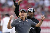 Houston head coach Dana Holgorsen tosses his headset during the second half of an NCAA college football game against Kansas, Saturday, Sept. 17, 2022, in Houston. (AP Photo/Eric Christian Smith)
