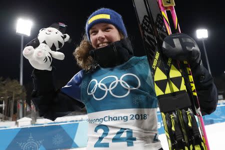 Biathlon - Pyeongchang 2018 Winter Olympics - Women's 15km Individual Final - Alpensia Biathlon Centre - Pyeongchang, South Korea - February 15, 2018 - Gold medalist Hanna Oeberg of Sweden celebrates during the victory ceremony. REUTERS/Murad Sezer