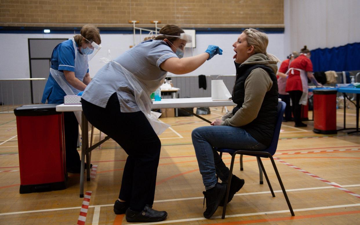 A nurse administers a test in Stoke-on-Trent during a testing session using the newly-supplied lateral flow Covid-19 tests - Jacob King /PA