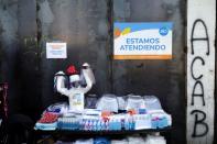 A mannequin with a protective mask is seen at a street vendor's stall, during a preventive quarantine after the outbreak of the coronavirus disease (COVID-19), in Santiago