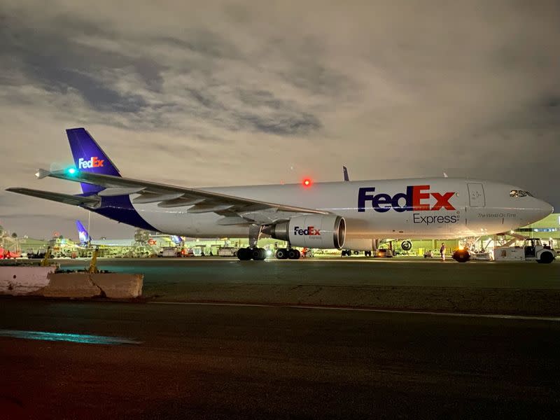 A plane of FedEx Express carrying a first batch of Pfizer/BioNTEch COVID-19 vaccine is seen at LAX Airport, in Los Angeles