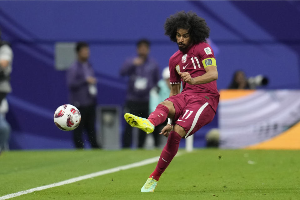 Qatar's Akram Afif passes the ball during the Asian Cup Group A soccer match between Tajikistan and Qatar at Al Bayt stadium, in Al Khor, Qatar, Wednesday, Jan. 17, 2024. (AP Photo/Aijaz Rahi)