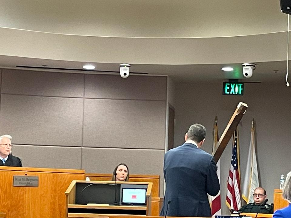 Defense lawyer A. Antonio Tomas asks a Sheriff's Office official questions about a piece of evidence he was holding during Isaiah Wilshaun Maeweathers' murder trial.
