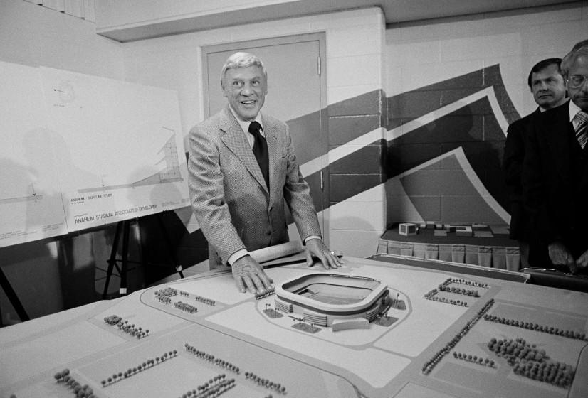 Carroll Rosenbloom, owner of the Los Angeles Rams, poses with model of Anaheim Stadium.