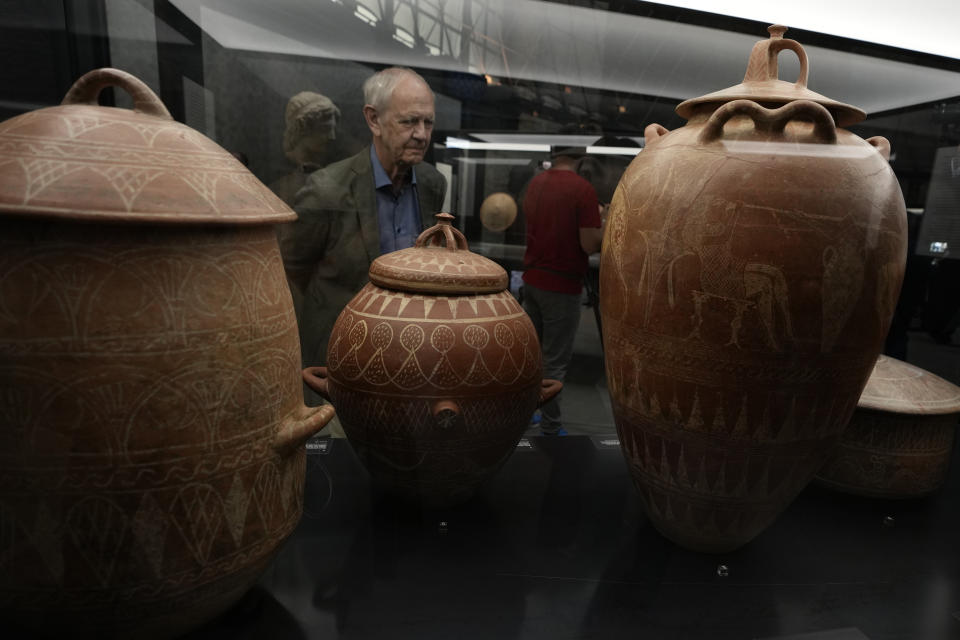 Etruscan jars from the 7th century B.C. are displayed in the new "Museum of Rescued Art" in Rome, Wednesday, June 15, 2022. Italy has been so successful in regaining ancient artworks and artifacts illegally exported from the country that it has now created a museum just for them, the Museum of Rescued Art, inaugurated on Wednesday in the cavernous Octagonal Hall of the ancient Baths of Diocletian. (AP Photo/Alessandra Tarantino)