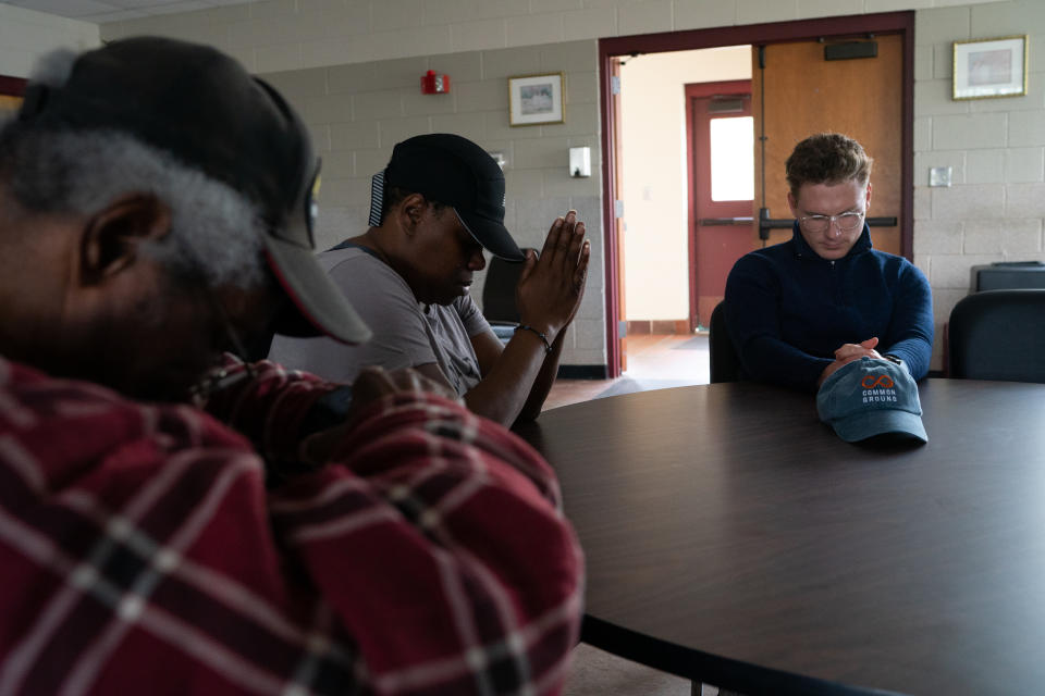 Kevin joins residents of Locust Court, another city property, in prayer at a strategy meeting. (Sarah L. Voisin/The Washington Post)