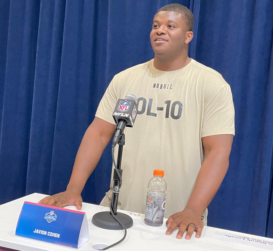 Offensive lineman Javion Cohen, formerly of the University of Miami and Alabama, speaks to reporters at the NFL Combine in Indianapolis.