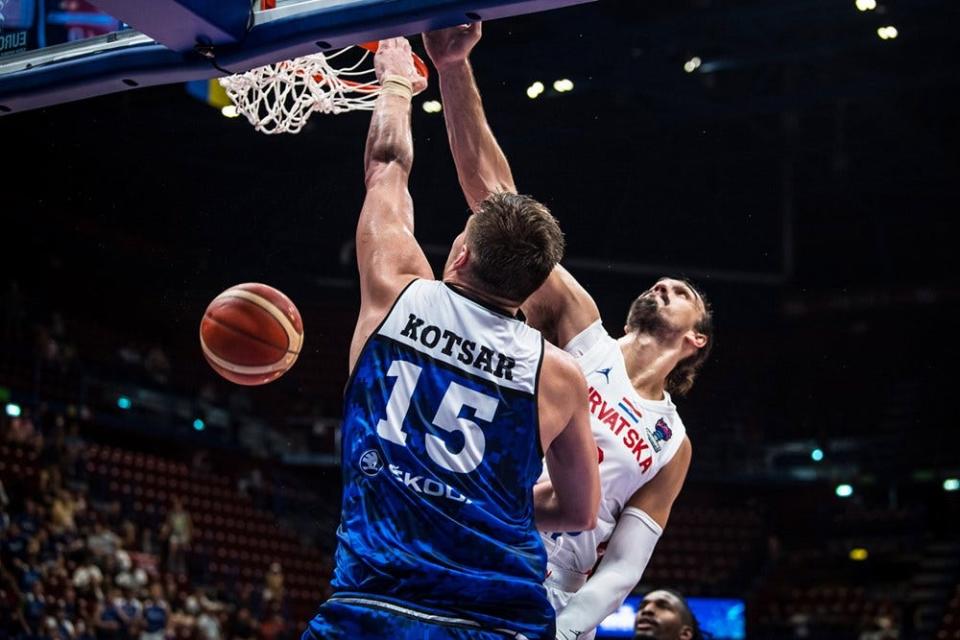 Maik-Kalev Kotsar dunks over Dario Saric in Estonia's loss Tuesday to Croatia in EuroBasket play in Milan, Italy.