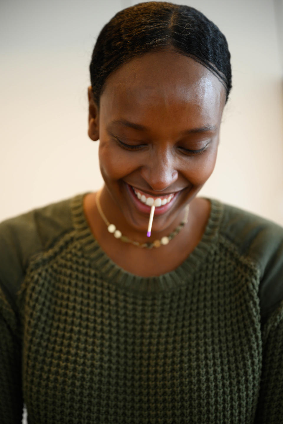 In order to prevent tearing up while chopping onions, Hassan holds a match between her front teeth. The theory is that the red end of the match absorbs the sulfuric compounds before they can reach your eyes. (Kara Birnbaum/TODAY)