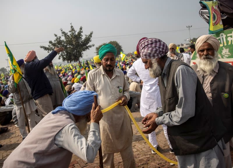Farmers and agricultural workers attend a rally against farm laws in Barnala