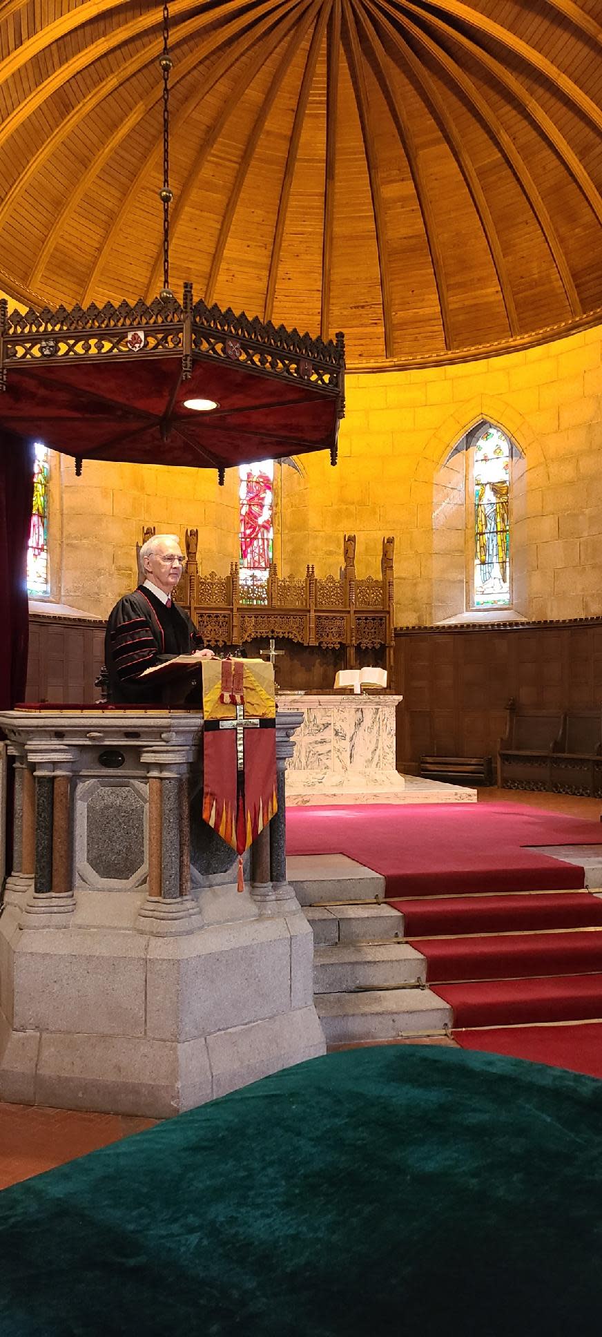 Rev. Dr. Richard Gibbons of First Presbyterian Church Greenville stands at Crathie Parish Church's pulpit.