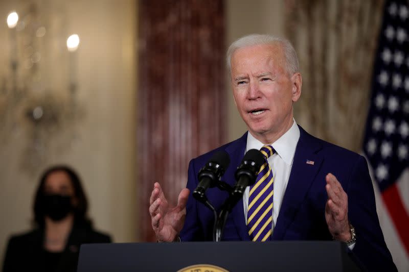 FILE PHOTO: U.S. President Joe Biden delivers a foreign policy address as Vice President Kamala Harris listens, at the State Department in Washington