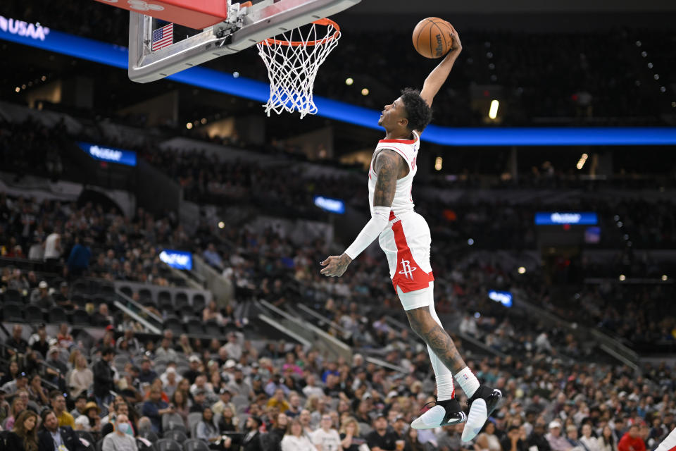 Houston Rockets' Jalen Green dunks during the first half of an NBA basketball game against the San Antonio Spurs, Saturday, March 4, 2023, in San Antonio. (AP Photo/Darren Abate)