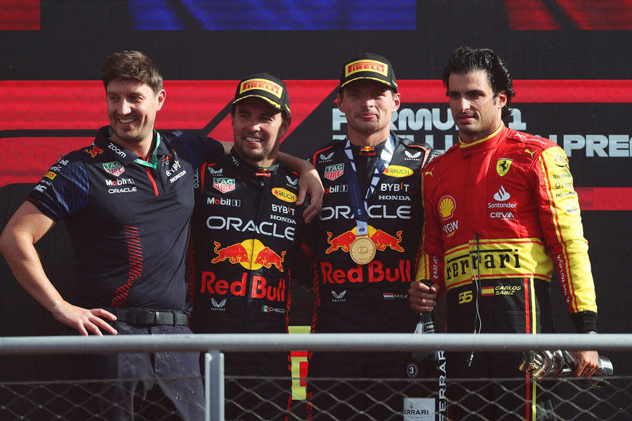 Carlos Sainz on podium with Max Verstappen and Sergio Perez