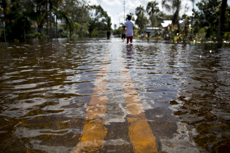 <p>Water covers a residential street in Bonita Springs, Florida, U.S., on Sept. 12, 2017. Hurricane Irma smashed into Southern Florida as a Category 4 storm, driving a wall of water and violent winds ashore and marking the first time since 1964 the U.S. was hit by back-to-back major hurricanes. Photographer: Daniel Acker/Bloomberg via Getty Images </p>