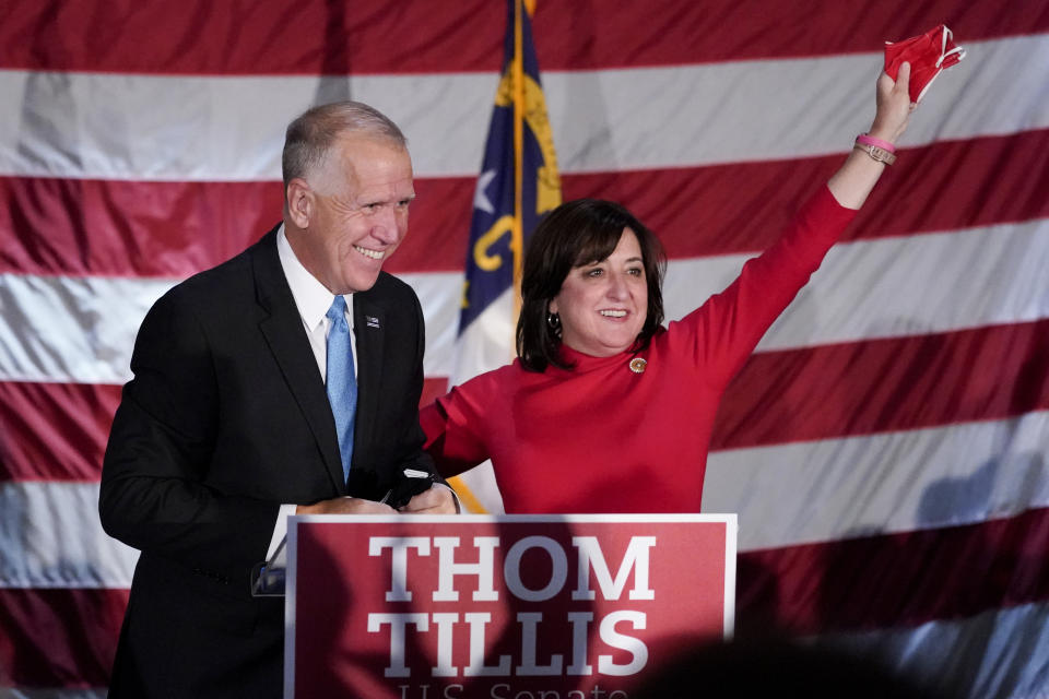 Sen. Thom Tillis, R-N.C., celebrates with his wife Susan, at a election night rally Tuesday, Nov. 3, 2020, in Mooresville, N.C. (AP Photo/Chris Carlson)