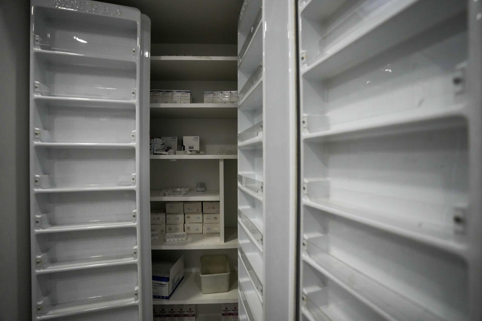 Almost empty shelves seen at the medical storage of the government-run Rafik Hariri University Hospital in Beirut, Lebanon, Wednesday, Aug. 11, 2021. Many private hospitals, who offer 80% of Lebanon's medical services, are shutting down because of lack of resources or turning away patients who can't pay. (AP Photo/Hassan Ammar)