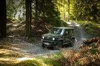 <p>The Jimny's four-wheel-drive system features a two-speed low-range transfer case for navigating serious off-road terrain.</p>