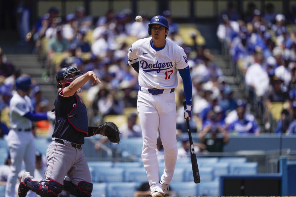 Los Angeles Dodgers designated hitter Shohei Ohtani reacts after a swinging strike during the third inning of a baseball game against the Washington Nationals, Wednesday, April 17, 2024, in Los Angeles. (AP Photo/Ryan Sun)