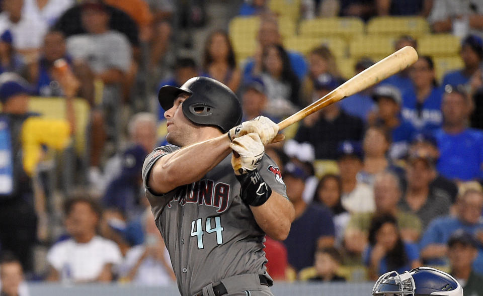 FILE - In this Aug. 31, 2018 file photo Arizona Diamondbacks' Paul Goldschmidt hits a two-run home run during the first inning of a baseball game against the Los Angeles Dodgers in Los Angeles. The St. Louis Cardinals have acquired Goldschmidt from the Diamondbacks in a multiplayer trade. The Cardinals sent pitcher Luke Weaver, catcher Carson Kelly, minor league infielder Andy Young and a 2019 draft pick to Arizona in the deal Wednesday, Dec. 5, 2018. (AP Photo/Mark J. Terrill)