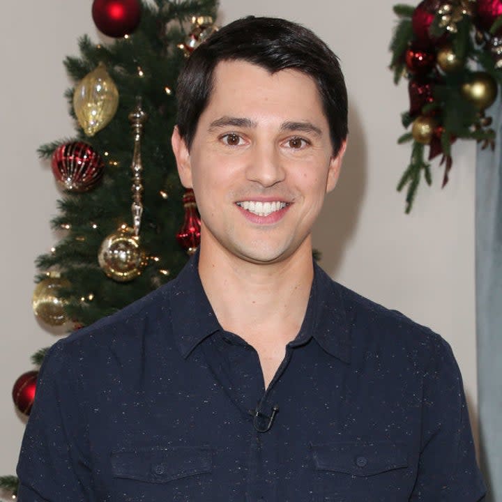 Nicholas D'Agosto posting at a Christmas event