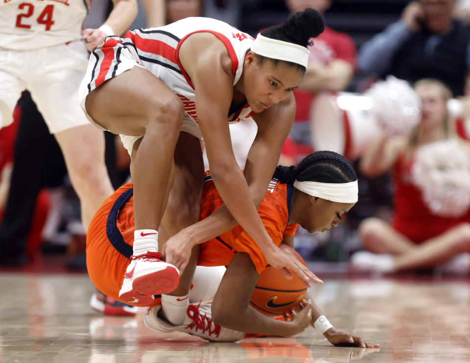 Ohio State guard Taylor Thierry, top, and Illinois guard Genesis Bryant work for the ball during the second half of an NCAA college basketball game in Columbus, Ohio, Sunday, Jan. 8, 2023. (AP Photo/Paul Vernon)