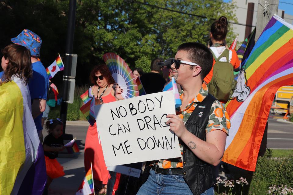 A counter-protester, aligned with Sault Pride and other members of the local LGBTQ+ community, holds a sign that reads "Nobody Can Drag Me Down" during Monday's demonstration at the corner of Spring and Bay Street. Public drag events have become an increasingly contentious issue over the last two years, with protests popping up at both branches of the Sault Ste. Marie Public Library since early 2023.