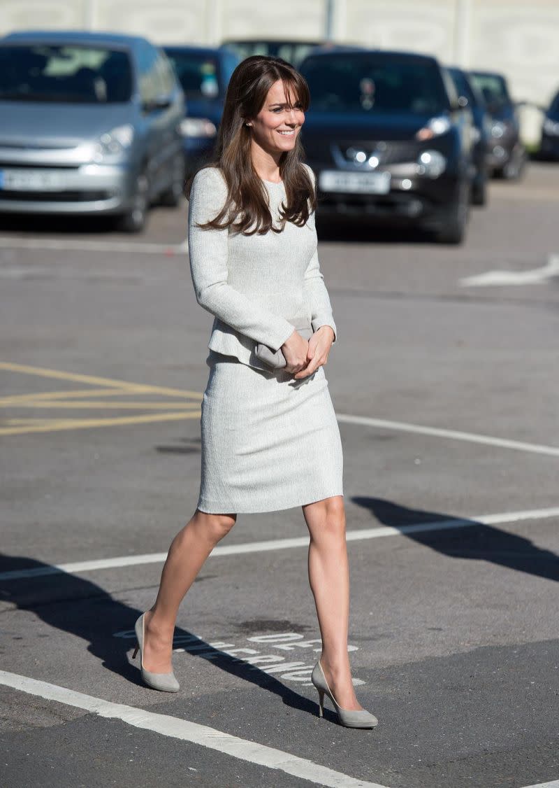 The Duchess of Cambridge in a silver dress from the Fold visiting a women’s prison. 