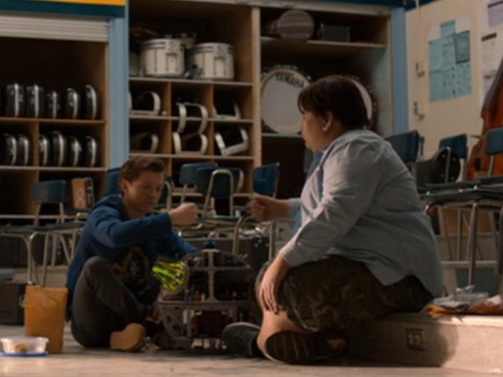 Peter Parker and Ned Leeds doing a handshake in &quot;Spider-Man: Homecoming.&quot;