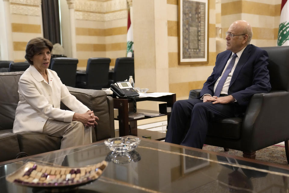 Lebanese Prime Minister Najib Mikati, right, meets with French Foreign Minister Catherine Colonna in Beirut, Lebanon, Friday, Oct. 14, 2022. Colonna is in Beirut to meet with Lebanese officials. (AP Photo/Hussein Malla)
