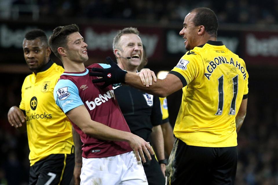 Football Soccer - West Ham United v Aston Villa - Barclays Premier League - Upton Park - 2/2/16 Aston Villa's Gabriel Agbonlahor, West Ham's Aaron Cresswell and referee Jonathan Moss share a joke Action Images via Reuters / Andrew Couldridge Livepic EDITORIAL USE ONLY. No use with unauthorized audio, video, data, fixture lists, club/league logos or "live" services. Online in-match use limited to 45 images, no video emulation. No use in betting, games or single club/league/player publications. Please contact your account representative for further details.