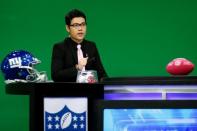 Chinese commentator Wang Zixing comments on a NFL American football game during a lifestream broadcast in a studio of the media and gaming firm Tencent Holdings in Beijing, China, October 16, 2017. REUTERS/Thomas Peter