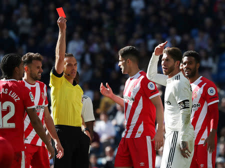 Soccer Football - La Liga Santander - Real Madrid v Girona - Santiago Bernabeu, Madrid, Spain - February 17, 2019 Real Madrid's Sergio Ramos is shown a red card by referee Guillermo Cuadra REUTERS/Susana Vera