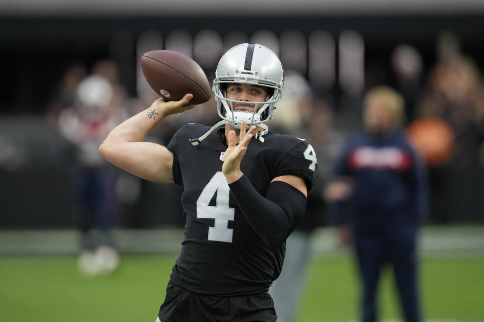 Las Vegas Raiders quarterback Derek Carr (4) warms up before an NFL preseason football game against the New England Patriots, Friday, Aug. 26, 2022, in Las Vegas. (AP Photo/John Locher)