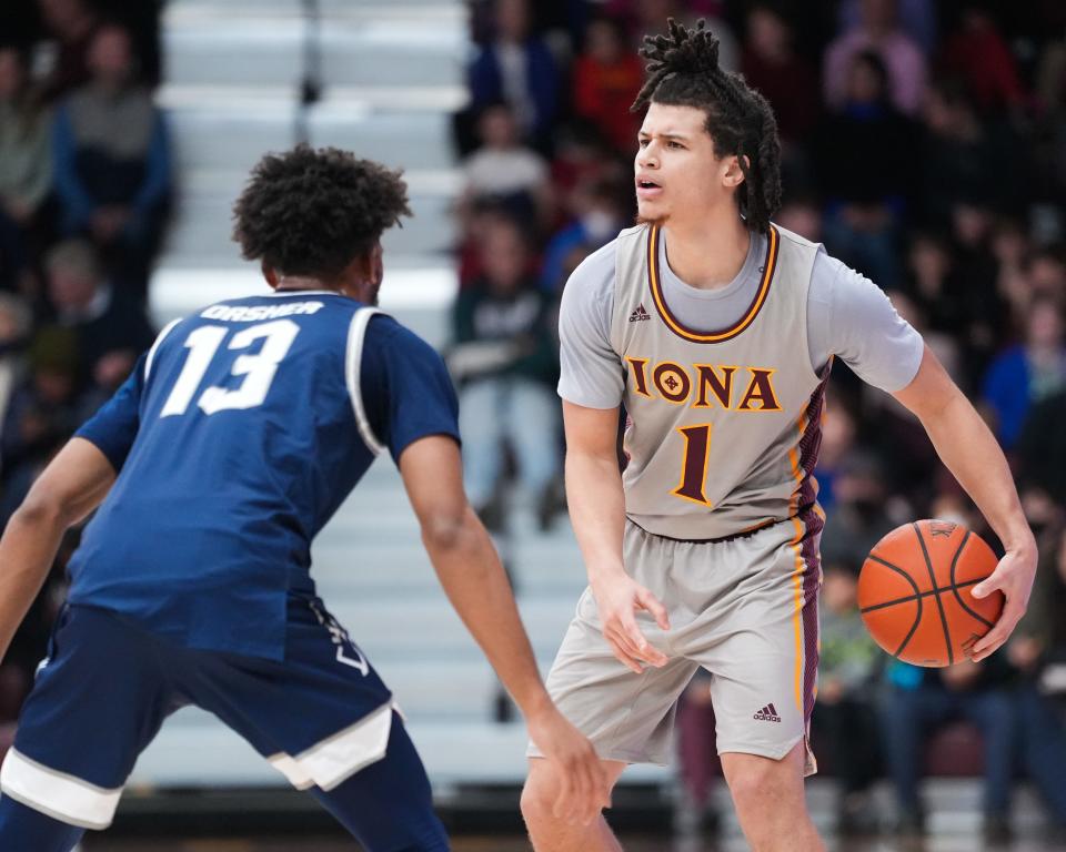 Iona's Walter Clayton Jr. (1) assesses the court during the Gaels' 73-55 win over Saint Peter's on Sunday, Jan. 1, 2022 at the Hynes Athletic Center.