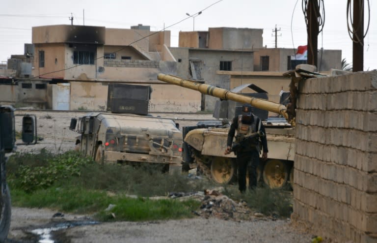 Iraqi government forces are pictured in the northern town of Qayyarah on August 24, 2016 after retaking key positions in the centre